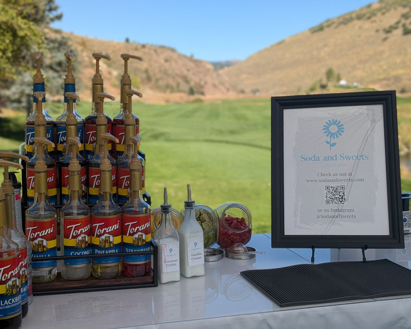 Custom soda blends for a corporate golf event.  The golf course and fairway are in view.  