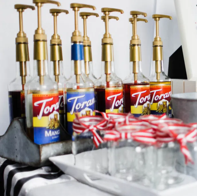 Flavored syrup bottles used to make flavored sodas.  