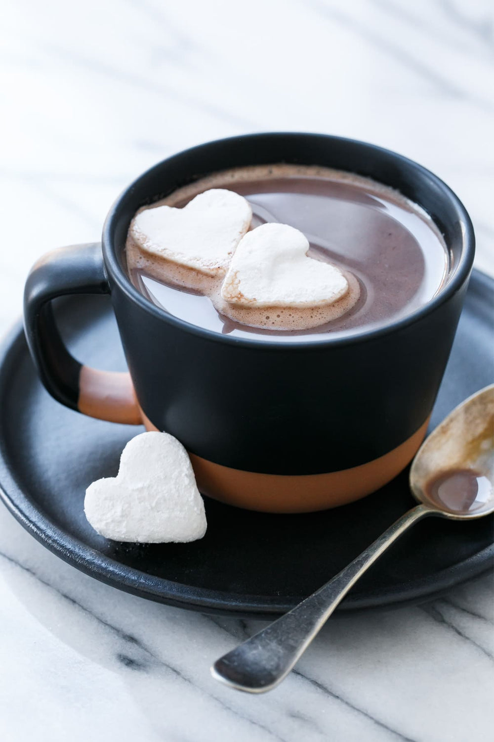 Cup of warm hot chocolate with marshmallows.  